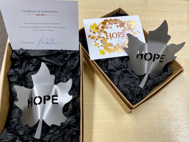 A Hope leaf in a commemorative box, with certificate of authenticity signed by the artist